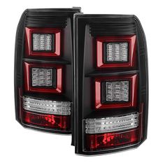 the tail lights of a red and black car