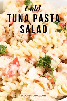 this pasta salad is loaded with tuna, tomatoes and parsley in a creamy sauce