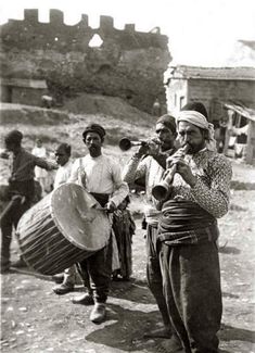 black and white photograph of men playing instruments