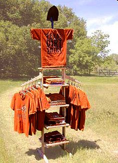 an orange shirt display in the middle of a field