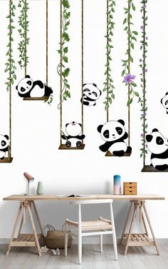 the panda bears are hanging from the tree branch wall decals in this office space