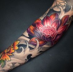 a person with a flower tattoo on their arm