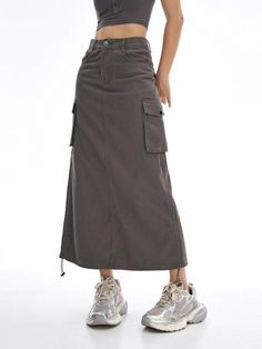 Introducing Our Latest Arrival Elevate your summer wardrobe with our New Cargo Long Skirt – a perfect blend of comfort, style, and versatility. This casual drawstring skirt with pockets is designed for the modern woman who values both fashion and functionality. Key Features Empire Waistline for a flattering fit Mid-Calf Length – the ideal balance of modesty and trendiness No-Nonsense Decoration – embrace simplicity with a clean look A-Line Silhouette for a graceful and timeless appeal Solid Pattern Type – a wardrobe staple that pairs effortlessly Crafted from a blend of Cotton and Polyester for ultimate comfort Non-Stretch Elasticity for a structured and reliable fit Regular Fit – providing comfort without compromising style When to Wear This high-waisted skirt is your go-to choice for cas Gray Lined Skirt, Summer Skirt With Cargo Pockets, Cargo Long Skirt, Drawstring Skirt, Empire Waistline, Skirt With Pockets, Natural Curves, Summer Evening, Skirts With Pockets