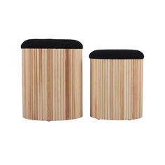 two wooden stools with black cushions on them