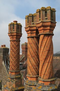 two large brick pillars on top of a building