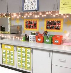 the kitchen is decorated with yellow and green bins