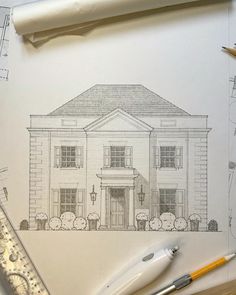 a pencil drawing of a house on top of paper