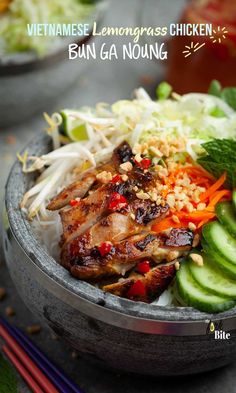 vietnamese lemongrass chicken bun ga noung with cucumbers and carrots in a bowl