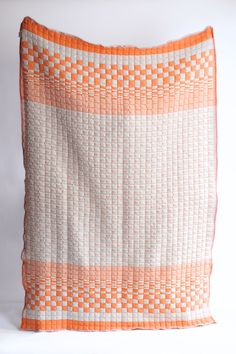 There are only two families in the world who are still practicing this craft. Sujani weaving is a double-cloth technique that creates cotton-filled "puffs" with a wonderfully unique and soft texture. Whether draped over your bed, sofa, or used as a cozy wrap, this blanket is as versatile as it is beautiful. Our quilts are hand-loomed in the home of our artisans in Gujarat, India. Each quilt takes upwards of 14 hours to make. The family is among the last remaining artisans with the knowledge of t