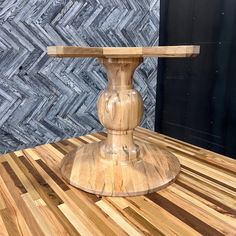 a wooden table top with a wood base