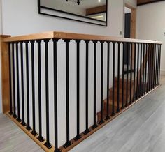 a wooden and metal stair rail in a house