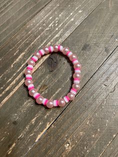 Description Add a touch of whimsy to your outfit with this Pink Pearl & Pink Clay Beaded Stretch Bracelet. Made with stretchy elastic for a comfortable fit, this bracelet features faux pink pearl beads and shades of pink clay beads for a unique and playful look. Perfect for anyone who loves to add a bit of fun to their wardrobe! Details Length: 7" faux pearl beads shades of purple Clay beads disc shaped clay beads Features One of a kind, fashion jewelry, everyday jewelry Great gift for that spec Jewelry Everyday, Creative Memories Scrapbooking, Pearl Pink, Pink Clay, Creative Memories, Shades Of Pink, Beaded Stretch Bracelet, Pink Pearl, Everyday Jewelry