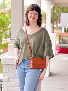 The Kailani Top is an oversized, but comfortable top that can be easily paired with any type of bottoms! This top is perfect for lounging at home, or running your daily errands. Pair this top with leggings and boots, or jeans and casual sneakers for your everyday, go-to outfit. Item Details: Short Sleeves V-Neck High-Low Length Oversized Side Slits Detail Fabric Content: 100% Cotton Fit Details: Sierra is wearing a size medium. We find that the Kailani Top runs oversized, if you are wanting a mo Fit Details, Comfortable Tops, Running Tops, Casual Sneakers, High & Low, High Low, At Home, Short Sleeves, Size Medium