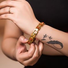 This Gold plated bracelet features a 5 face rudraksha bead, symbolizing the 5 elements, and handmade. A spiritual gift for yoga lovers, this Shiva-inspired bracelet emanates a unique and elegant energy, perfect for sophisticated tastes. Five mukhi rudraksha is a symbol of five forms of Lord Shiva, named as ‘RudraKalagni’. It helps the wearer to gain good health and peace. Rudraksha cultivates wisdom and intellect and helps to attain success in all walks of life. It brings positivity and serenity Shiva Gold Rings For Men, Rudraksha Bracelet Men Gold, Rudraksha Jewelry For Men, Gold Rudraksha Bracelet, Rudraksha Jewelry, Rudraksha Bracelet, Rudraksha Beads, 5 Elements, Mens Gold Bracelets