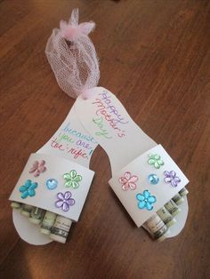 a pair of flip flops made out of money and some paper with writing on them