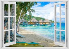 an open window with a view of the beach and water in front of it,