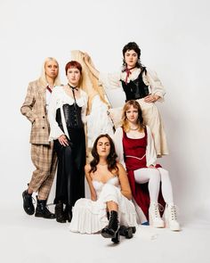 a group of people dressed in costume posing for a photo