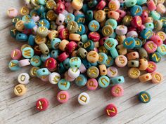 small beads with letters and numbers on them