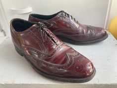 "Beautiful oxblood leather shoes with fine wingtip details.  In great condition with a couple of nics in the leather and some creasing above the toe. The heel and outer soles have some average wear. See detailed photos. Marked a size men's 7D (wide) and seem to fit as such.  Work well for a women's size 8.5 as well. Please see measurements. Measures 11 1/4\" from heel to toe along bottom, outer sole. Measures 3 7/8\" across widest part on bottom, outer sole. Heel measures 3/4\" Please ask any questions before purchasing, especially concerning fit or condition. All items are vintage and in condition as described. Shipping via USPS unless otherwise agreed upon. All sales final, no returns- Thank You from Collecting Dust!" Brown Wingtip Oxfords With Red Sole, Red Goodyear Welted Wingtip Oxfords, Vintage Goodyear Welted Wingtip Leather Shoes, Burgundy Leather Wingtip Oxfords, Burgundy Lace-up Oxfords With Leather Sole, Oxblood Leather, Wingtip Oxford, Leather Dress Shoes, Mens Oxfords