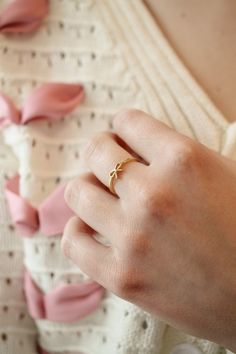 Is this not the cutest thing you have ever seen!? This cute little ring has a super dainty bow pendant design and is made with 18k gold plated brass. It is an adjustable ring which means it can be resized by gently pulling on the opening at the back of the ring(This ring best accommodates sizes 6-8). It is great quality, and tarnish resistant, and we absolutely promise it won't turn your skin green..... ever! Gold Rings Delicate, Bow Ring Gold, Minimal Ring Design, Simple Gold Rings For Women, Latest Ring Designs Gold For Women, Gold Rings Aesthetic Simple, Minimal Rings Gold, Gold Ring Design For Women Latest Gold Ring Design For Women, Simple Ring Designs Gold