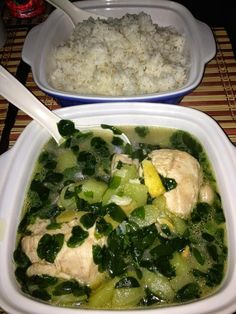 two bowls filled with food on top of a table next to rice and broccoli