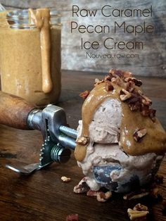 an ice cream sundae with walnuts and pecan maple syrup in the background