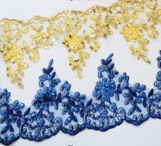 blue and gold lace with flowers on it