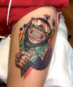 a man with a monkey tattoo on his thigh