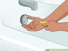 a person washing their hands in a sink with soap on the water faucet