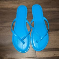 Never Worn. Casual Blue Sandals For Summer, Light Blue Round Toe Sandals For Summer, Casual Blue Flat Flip Flops, Casual Light Blue Sandals For Vacation, Light Blue Flat Sandals For Summer, Casual Blue Flip Flops For Summer, Casual Flat Flip Flops For The Pool, Light Blue Casual Beach Sandals, Casual Flat Flip Flops For Pool