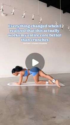 a woman in blue swimsuit laying on top of a surfboard with words above her