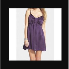 Love Fire Color: Purple. V-Neckline. Empire Waistband. Spaghetti Straps. A-Line. Side Zipper Closure. Measurements Are Taken On A Flat Surface As Accurately As Possible. Bust: Underarm To Underarm 15" Waist: 12 1/2" Length: Underarm To Hem 22 1/2" Shell: 100% Polyester. Lining: 100% Polyester. Care: Machine Wash. Condition: New With Tags. Purple Mini Dress For Summer Bridesmaid, Purple Mini Dress For Bridesmaid In Summer, Purple Bridesmaid Mini Dress, Ruffle Floral Maxi Dress, Deep Purple Dress, Beach Mini Dress, Love Fire, Lace Overlay Dress, Bow Detail Dress