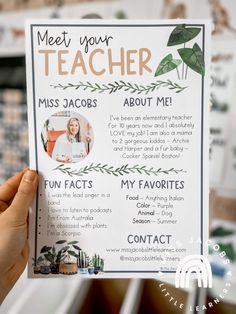 someone holding up a teacher's poster with the words meet your teacher on it