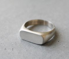 a silver ring sitting on top of a table