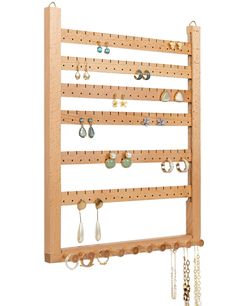 PRICES MAY VARY. Capacity: 6 wooden slats provide space that hold up to 99 pairs of earrings (each slat has 17 holes and 16 slots). 10 knobs across the bottom hold necklaces, bracelets, lanyards, eyeglass holders, scarves, hairbands, and rings. No more tangled mess of earrings and necklaces as in a jewelry box. The Knobs provide length required for short or long necklaces and usually more than one can hang on a knob. Picture Frame Size: Measuring 11 2/5 x 14 1/4inches, which is the normal size o Earring Wall, Stud Earring Organizer, Cork Jewelry, Earring Hanger, Wall Mount Jewelry Organizer, Jewelry Frames, Picture Frame Sizes, Wall Holder, Jewelry Organizer Wall