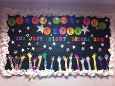 a bulletin board with hand prints and stars on it