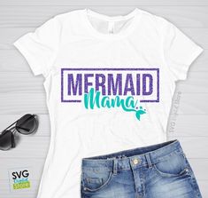 a white shirt with the words mermaid mama on it next to sunglasses and eyeglasses