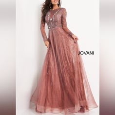 This Jovani Beaded Gown Has Been Crafted From Embroidered Tulle. It Features A Round Neck, Long Sleeves, Back Zip Closure, Beaded Embroidery All Over And A Flared, Floor Length Skirt. Materials & Product Care Outer Composition: 100% Beaded Tulle Washing Instructions: Dry Clean Rose Gold Gowns Elegant, Gold Gowns Elegant, Rose Gold Gowns, Gold Gowns, Jovani Gown, Gowns Elegant, Beaded Evening Gowns, Long Sleeve Evening Gowns, Unique Prom Dresses