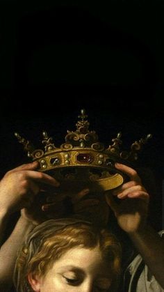 a woman holding a crown over her head