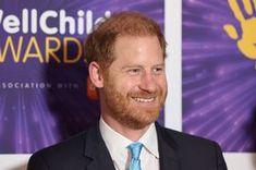 a smiling man in a suit and tie