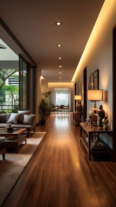 an empty living room with wood floors and large glass doors that lead to the outside