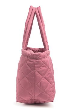 A medium sized tote bag is perfect for a "go-anywhere" style and features a quilted design. 11.5" H x 18.5" W x 8" D 10.5" strap drop Top zip closure Quilted exterior PU and terylene exterior Imported Trendy Pink Quilted Bag, Elegant Quilted Pink Bag, Pink Quilted Rectangular Shoulder Bag, Pink Quilted Bag For On-the-go, Pink Puffer Tote Bag, Medium Tote Bag, Drop Top, Medium Tote, Dusty Rose