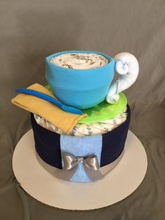 there is a cake made to look like a hat with a bowl and spoon on top