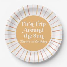 there comes the sun paper plate with an orange and white design on it that reads here comes the sun, heaven's 1st birthday