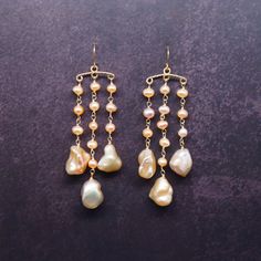 "Beautiful baroque pearl earrings. All the pearls are natural. Baroque pearls have wrinkled and metallic surface. Each one is different in shape and size. Please accept and appreciate their uniqueness. I design and made it by hand. It can be a perfect gift for yourself or your friends. -------------------------- D E T A I L S * Ear hook and other materials are 100% Top quality 14k gold filled from USA * Perfect for someone with sensitive skin ❤  * The earrings are 6 cm long (including the hooks) and about 2 cm wide * Each jewelry is handmade with love and care ❤  * Comes in a branded gift box   -------------------------- 1 4 K  G O L D  F I L L E D  * Gold filled jewelry can last a lifetime if it is cared for properly * It is made with a thick layer of 14k gold on top of another metal, but Pink Baroque, Wrapped Earrings, Baroque Pearl Earrings, Birthstone Earrings, Wedding Anniversary Gift, Antique Necklace, Gold Filled Earrings, Wire Wrapped Earrings, June Birthstone