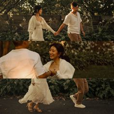 two people holding hands and walking in the park at sunset or sunrise, one woman is wearing a white dress