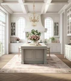 a large kitchen with an island and chandelier in the center, surrounded by windows