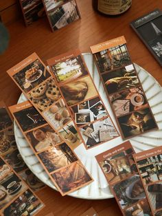 there are many pictures on the plate and some cards in front of them that have been placed together