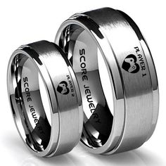 two wedding rings with horses engraved on them