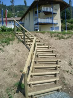 a set of wooden stairs leading up to a building